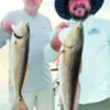 Steve Brigman and Brandon Butler with wintertime redfish from Laguna Madre.
